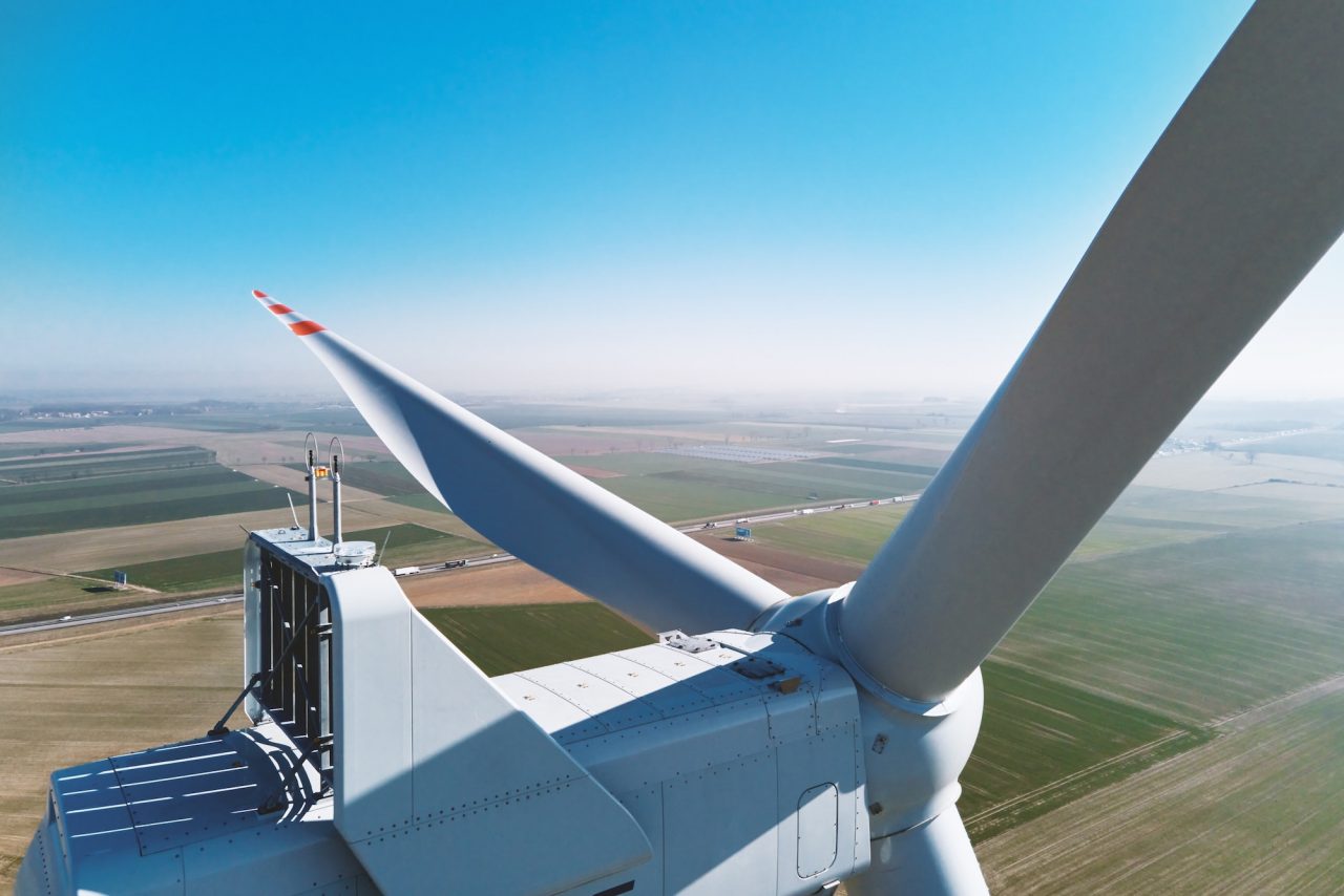 Aerial view of part of windmill turbine in countryside, Green energy