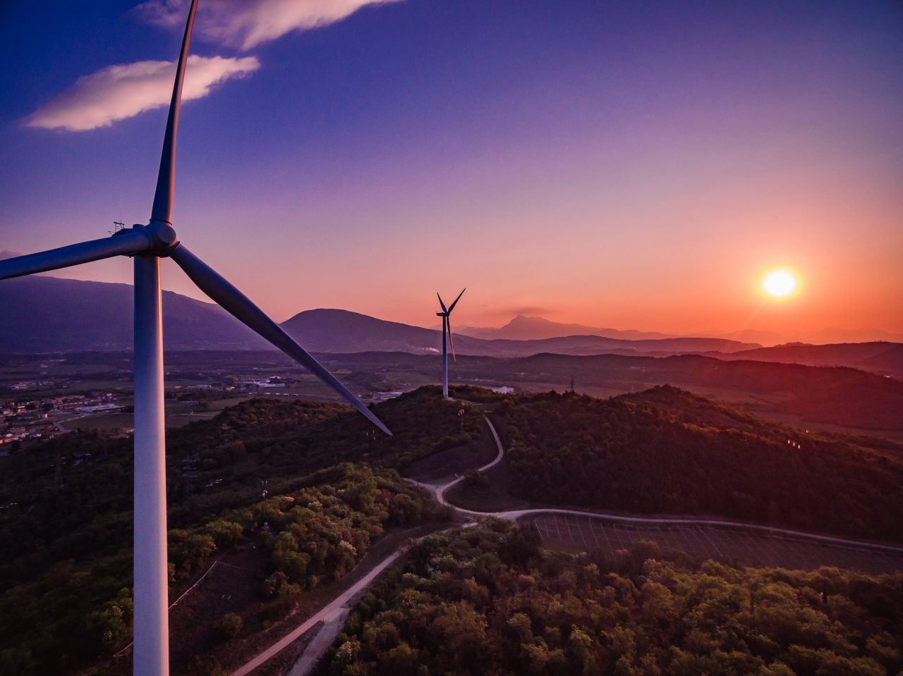 Wind Turbines Windmill Energy Farm at sunset in Italy